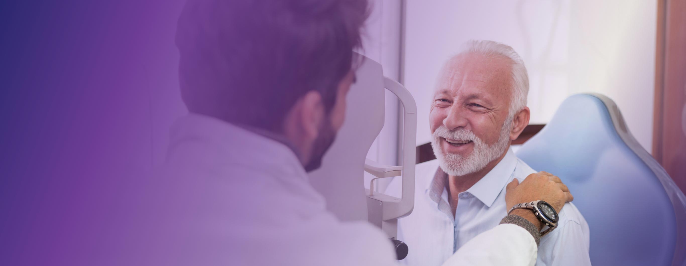 A doctor reassures an old man